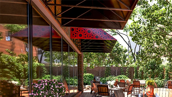 Red metal awning over cafe windows with a decorative pattern